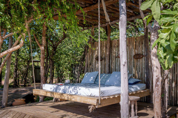 Changa_Safari_Camp-hanging-bed-by-the-pool